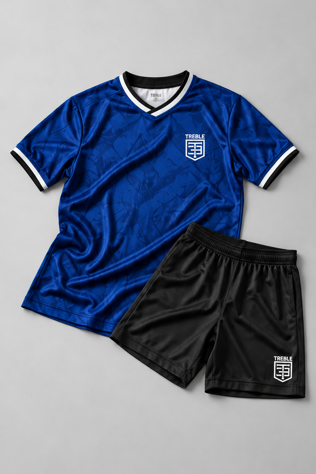 TREBLE custom soccer jersey and shorts flat lay