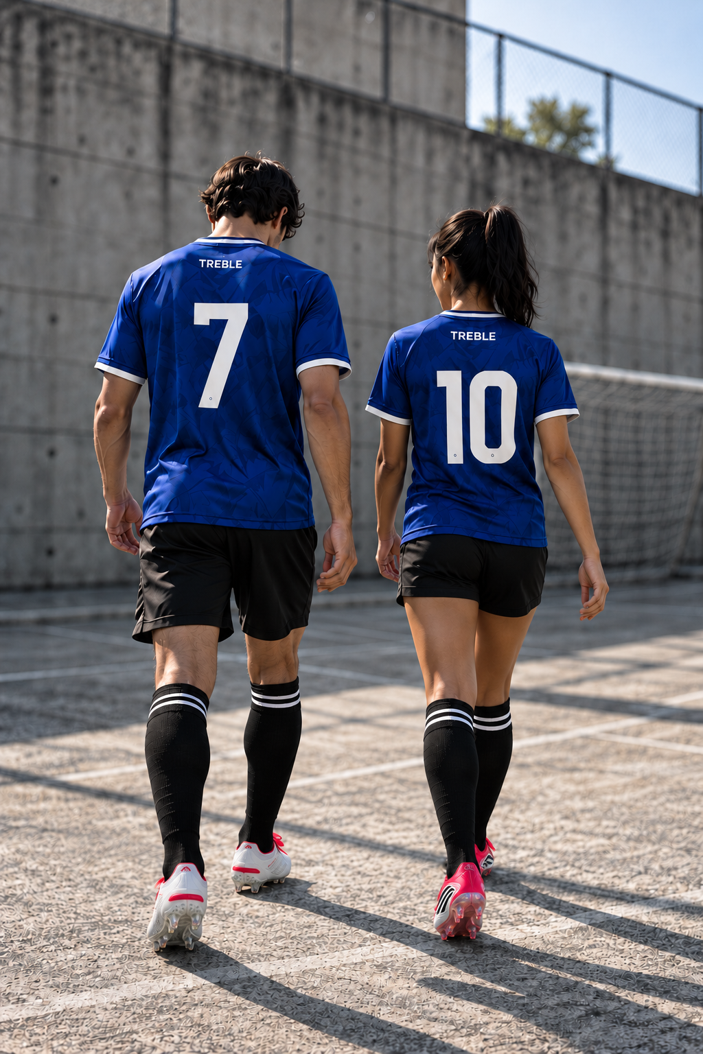 TREBLE soccer players walking away wearing Messi F50 and David Beckham Predator cleats